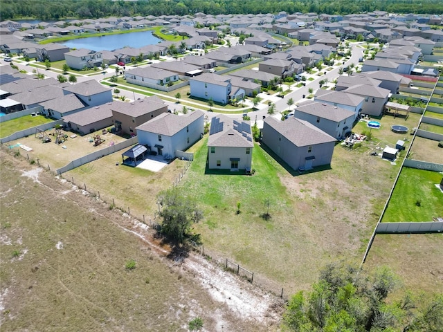 bird's eye view with a residential view and a water view