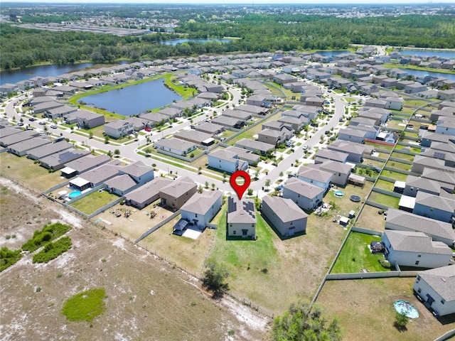 birds eye view of property featuring a residential view and a water view