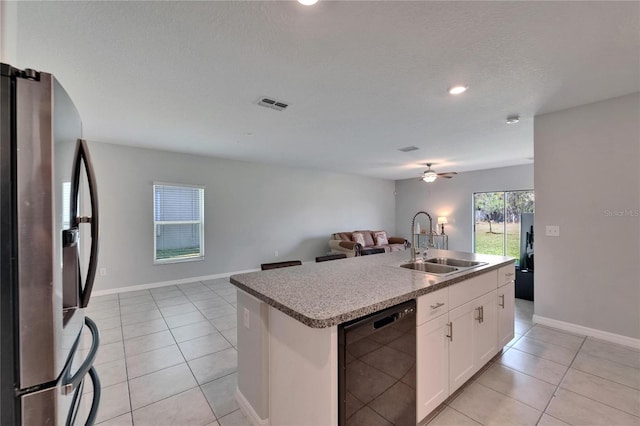 kitchen featuring visible vents, stainless steel refrigerator with ice dispenser, black dishwasher, a sink, and open floor plan
