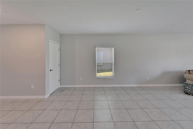 empty room featuring baseboards