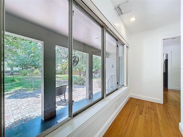 6920 Bougainvilla Ave S, Saint Petersburg, FL 33707 - hallway with wood finished floors, baseboards, visible vents, and recessed lighting