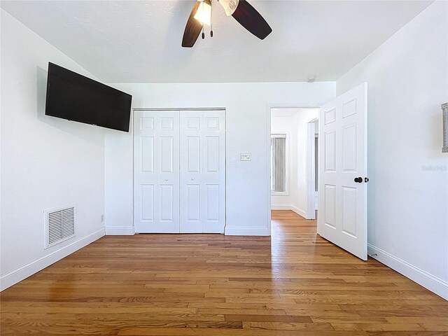 6920 Bougainvilla Ave S, Saint Petersburg, FL 33707 - unfurnished bedroom with visible vents, baseboards, light wood finished floors, and a closet