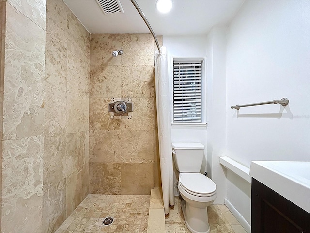 6920 Bougainvilla Ave S, Saint Petersburg, FL 33707 - full bath featuring vanity, visible vents, a tile shower, and toilet