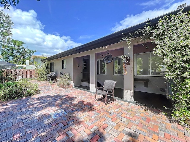6920 Bougainvilla Ave S, Saint Petersburg, FL 33707 - back of house featuring a patio, stucco siding, and fence
