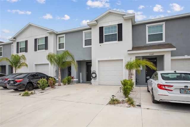33083 Frosted Clover Way, Wesley Chapel, FL 33545 - multi unit property featuring driveway, stucco siding, and an attached garage