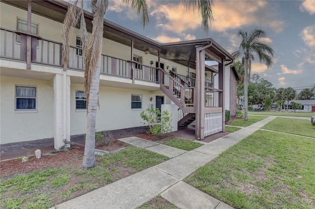8440 Old Post Rd Unit 104, Port Richey, FL 34668 - view of building exterior with stairway