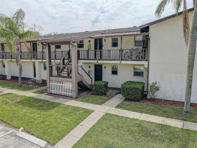 8440 Old Post Rd Unit 104, Port Richey, FL 34668 - view of property with stairway