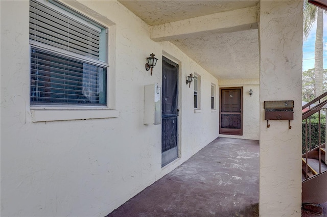 8440 Old Post Rd Unit 104, Port Richey, FL 34668 - entrance to property with stucco siding