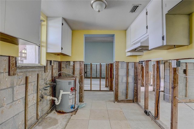 8440 Old Post Rd Unit 104, Port Richey, FL 34668 - utility room with water heater