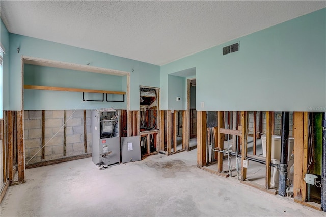 8440 Old Post Rd Unit 104, Port Richey, FL 34668 - misc room with a textured ceiling and concrete floors