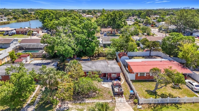 drone / aerial view with a residential view and a water view