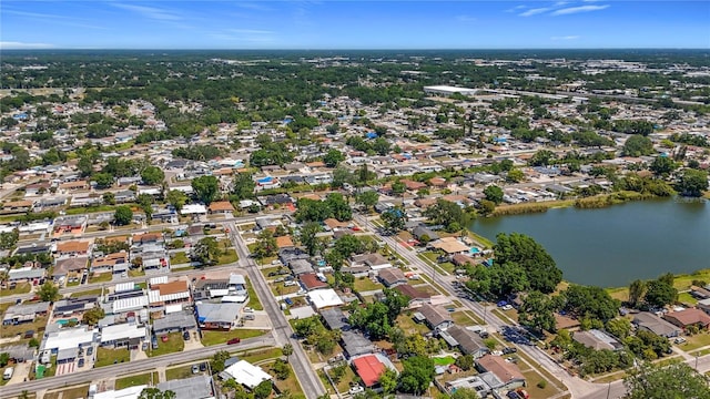 birds eye view of property with a residential view and a water view