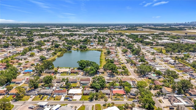 drone / aerial view with a water view and a residential view