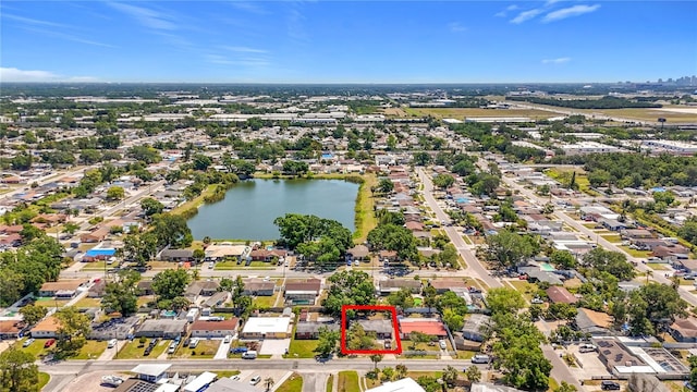 bird's eye view featuring a water view and a residential view