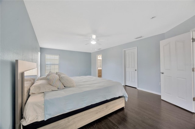 bedroom featuring ceiling fan, baseboards, and wood finished floors