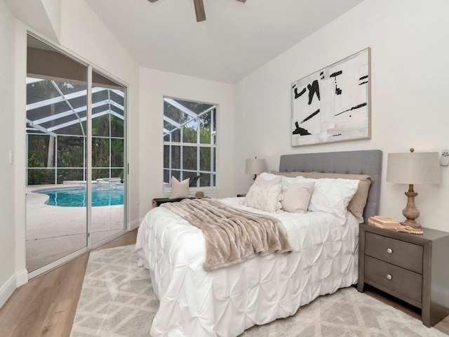 3728 Cypress Meadows Rd, Tampa, FL 33624 - bedroom with access to outside, light wood finished floors, a ceiling fan, and baseboards