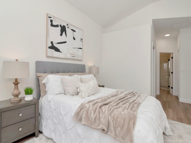 3728 Cypress Meadows Rd, Tampa, FL 33624 - bedroom featuring vaulted ceiling and light wood-type flooring