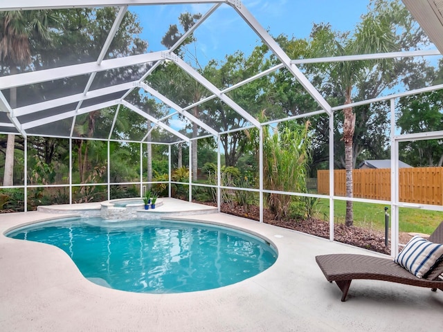 3728 Cypress Meadows Rd, Tampa, FL 33624 - view of swimming pool with a patio, a pool with connected hot tub, and a lanai