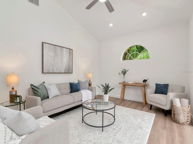 3728 Cypress Meadows Rd, Tampa, FL 33624 - living room featuring wood finished floors, lofted ceiling, a ceiling fan, baseboards, and recessed lighting