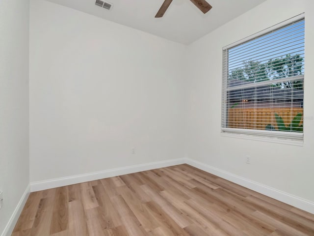 3728 Cypress Meadows Rd, Tampa, FL 33624 - unfurnished room with light wood-type flooring, baseboards, and a ceiling fan