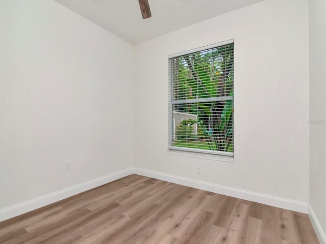 3728 Cypress Meadows Rd, Tampa, FL 33624 - unfurnished room with baseboards, light wood-style floors, and ceiling fan