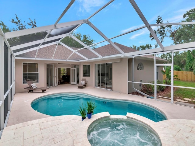 3728 Cypress Meadows Rd, Tampa, FL 33624 - view of pool featuring a patio, a pool with connected hot tub, and a lanai