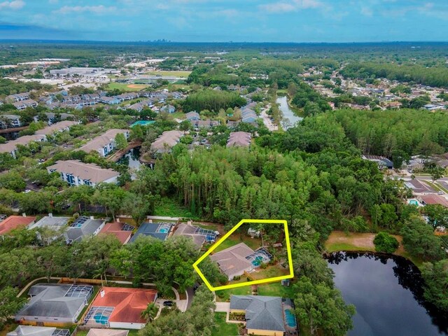 3728 Cypress Meadows Rd, Tampa, FL 33624 - aerial perspective of suburban area featuring property parcel outlined and a large body of water