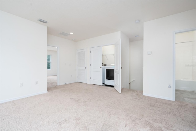 3844 Silverlake Way, Wesley Chapel, FL 33544 - unfurnished living room featuring light carpet, washer / clothes dryer, baseboards, and recessed lighting