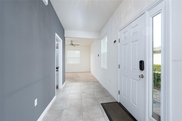 3844 Silverlake Way, Wesley Chapel, FL 33544 - foyer featuring baseboards, plenty of natural light, light tile patterned floors, and light colored carpet