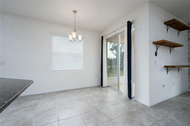 3844 Silverlake Way, Wesley Chapel, FL 33544 - unfurnished dining area with a chandelier, light tile patterned floors, and baseboards