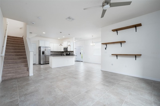 3844 Silverlake Way, Wesley Chapel, FL 33544 - unfurnished living room with ceiling fan, stairs, baseboards, light tile patterned floors, and recessed lighting