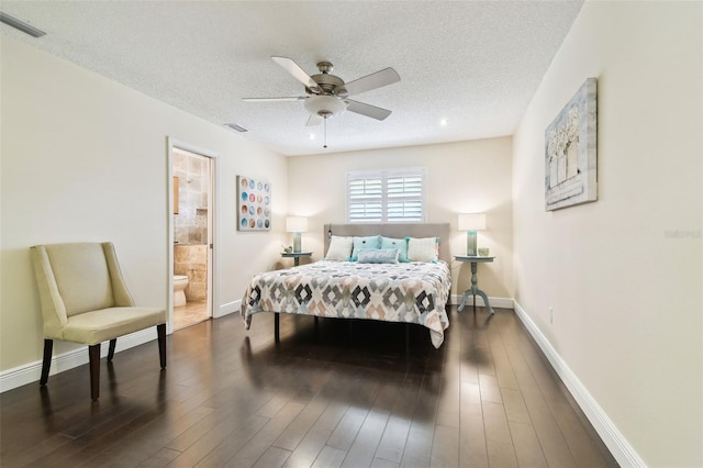 bedroom featuring visible vents, connected bathroom, a textured ceiling, and baseboards