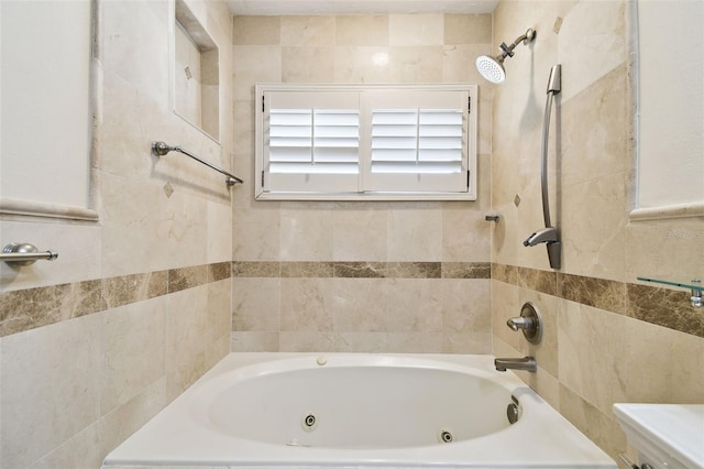 bathroom featuring toilet and a combined bath / shower with jetted tub