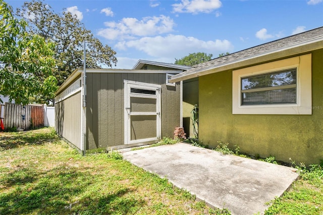 view of shed with fence