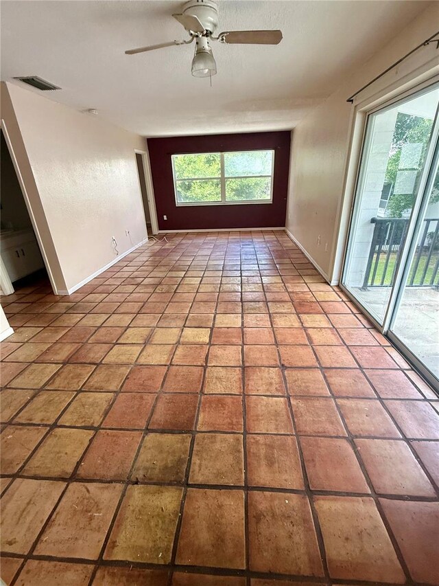 1550 11th St NE Unit G8, Winter Haven, FL 33881 - empty room featuring visible vents, baseboards, and ceiling fan