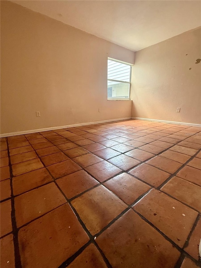 1550 11th St NE Unit G8, Winter Haven, FL 33881 - spare room with tile patterned flooring and baseboards