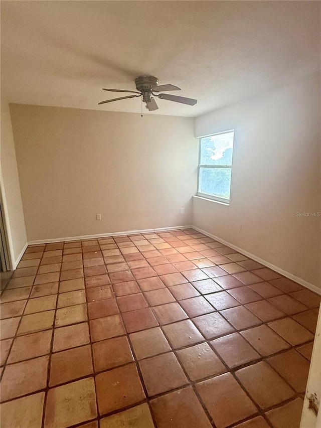 1550 11th St NE Unit G8, Winter Haven, FL 33881 - unfurnished room featuring baseboards, a ceiling fan, and light tile patterned floors