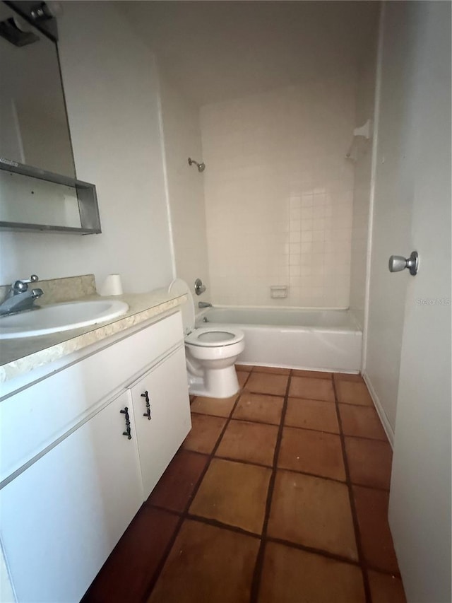 1550 11th St NE Unit G8, Winter Haven, FL 33881 - bathroom featuring toilet, tile patterned floors, vanity, and bathing tub / shower combination