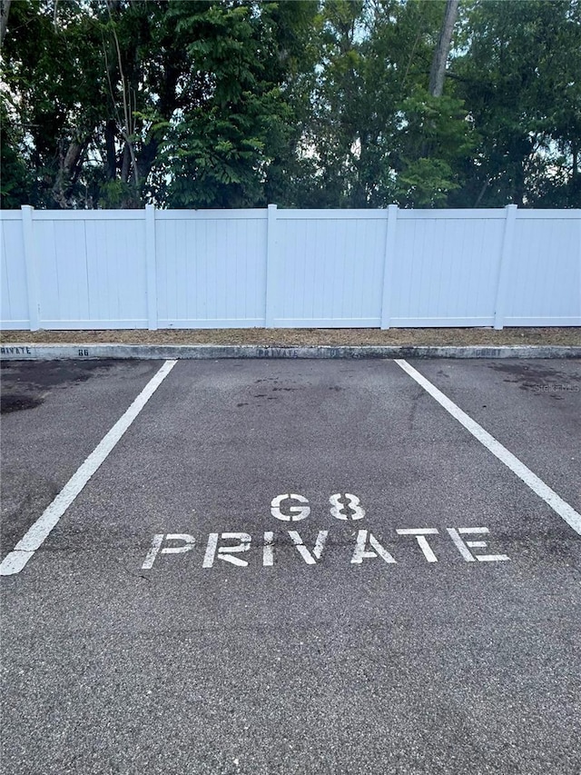 1550 11th St NE Unit G8, Winter Haven, FL 33881 - parking lot featuring fence