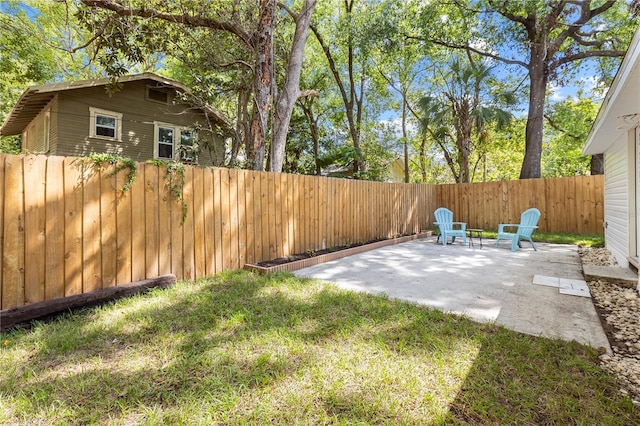 view of yard featuring a patio and a fenced backyard