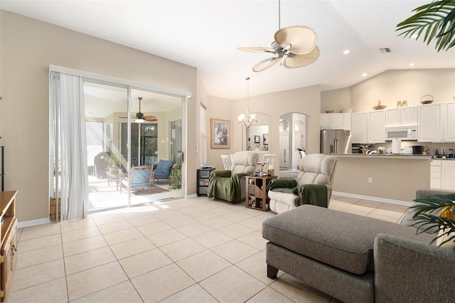 4656 Copper Hill Dr, Spring Hill, FL 34609 - living room featuring a wealth of natural light, arched walkways, light tile patterned flooring, and ceiling fan with notable chandelier