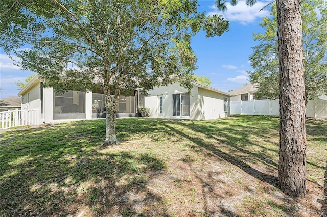 4656 Copper Hill Dr, Spring Hill, FL 34609 - view of yard with a fenced backyard and a sunroom