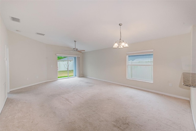 15410 Quail Woods Pl, Ruskin, FL 33573 - spare room featuring light carpet, visible vents, ceiling fan with notable chandelier, and baseboards