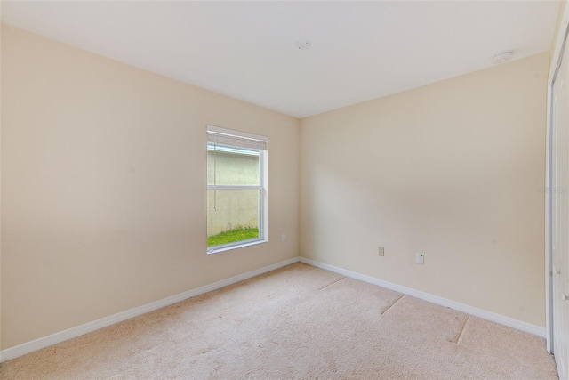15410 Quail Woods Pl, Ruskin, FL 33573 - unfurnished room featuring baseboards and light colored carpet