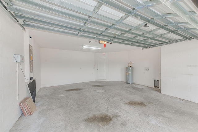 15410 Quail Woods Pl, Ruskin, FL 33573 - garage with a garage door opener and electric water heater
