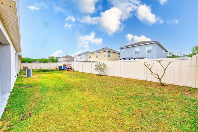 15410 Quail Woods Pl, Ruskin, FL 33573 - view of yard featuring a residential view, a fenced backyard, and cooling unit