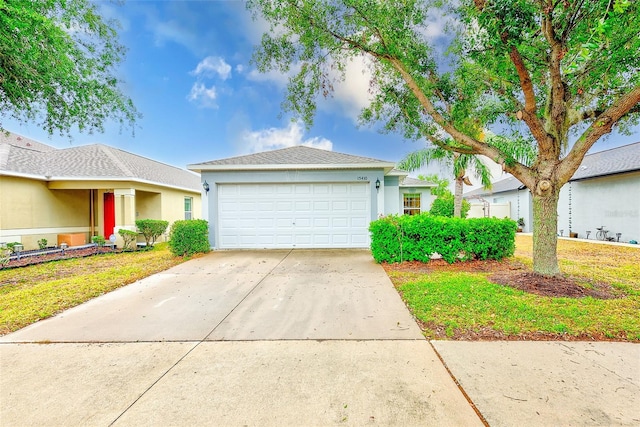 15410 Quail Woods Pl, Ruskin, FL 33573 - ranch-style house featuring driveway, a garage, and stucco siding