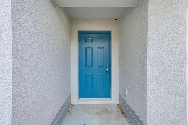 15410 Quail Woods Pl, Ruskin, FL 33573 - doorway to property featuring stucco siding