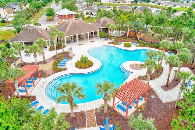 15410 Quail Woods Pl, Ruskin, FL 33573 - community pool featuring a patio and a residential view
