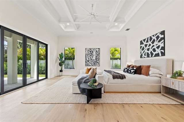 bedroom with coffered ceiling, access to outside, and wood finished floors